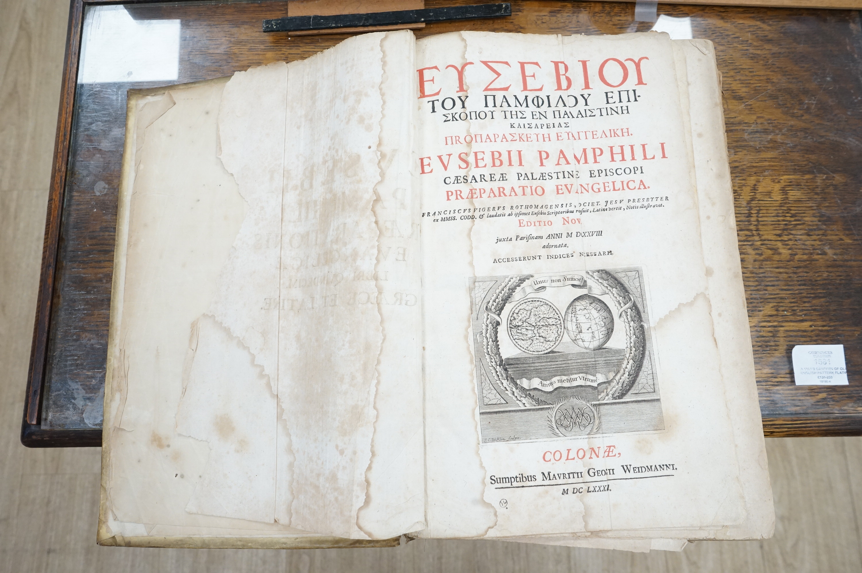 Eusebius - (Greek title) Pamphili Caesareae Palaestinae Episcopi Praeparatio Evangelica. editio nova. engraved title device, decorated initial letters; contemp. blind stamped vellum (distressed), folio, Cologne: M.G. Wei
